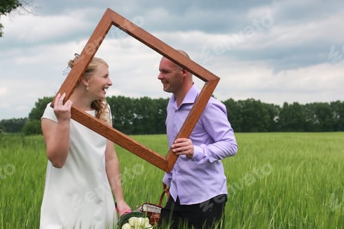 Preview: Couple Lovers Walking In A Green Field In Summer Day