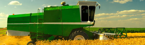 Preview: Combine Harvester Harvesting Wheat On A Wheat Field On Sunny Summer Day.