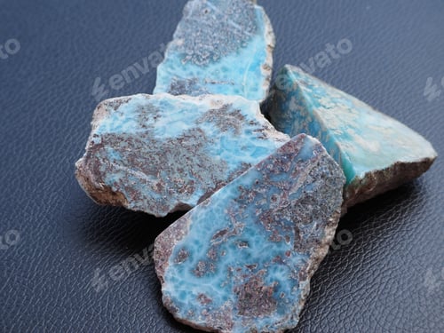 Preview: Raw Stones Larimar. Top Down View. Black Leather Background.