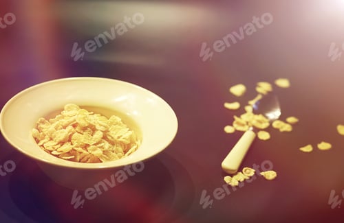 Preview: Corn Flakes In A Plate. Breakfast From Flakes With Honey And Milk. Fast Breakfast With Corn Flakes