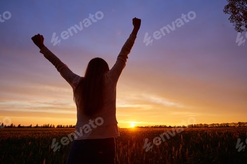 Preview: Girl With Open Arms On A Green Wheat Field In The Morning