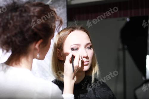 Preview: Young Girl With A Make-Up Artist In The Studio In Front Of A Mirror