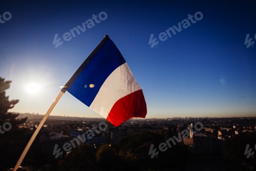 Preview: The Flag Of France On Background Of The View Of Paris From Sacre Coeur Basilica In France In Sunset