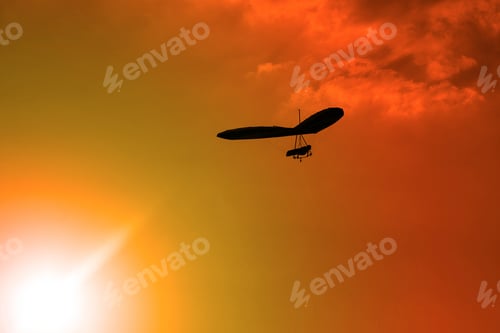 Preview: Hang-Glider Silhouette In Sky In Sunset Time
