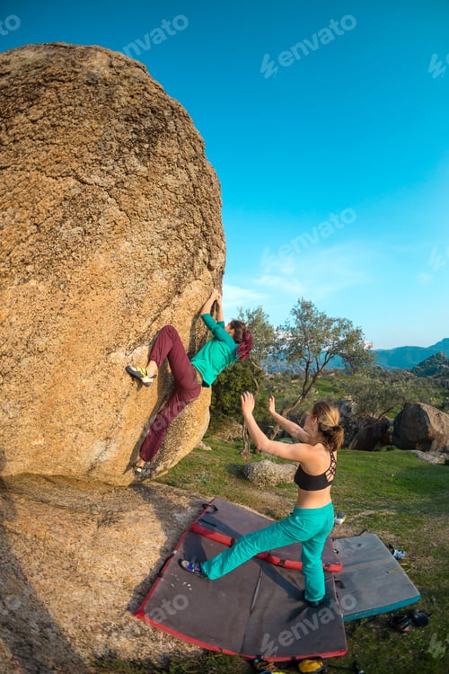 Preview: Two Young Girls Climb Bouldering Outdoors. Rock Climber Climbs A Difficult Route. Do Sports Outside