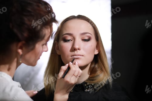Preview: Young Girl With A Make-Up Artist In The Studio In Front Of A Mirror