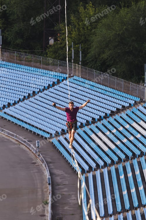 Preview: Highliner Goes Over The Stadium. A Man Walks Along A Stretched Sling Over The City. Ropewalker