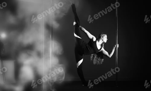 Preview: Girl Doing Exercises On A Sports Equipment. The Dancer On The Pylon In The Studio.