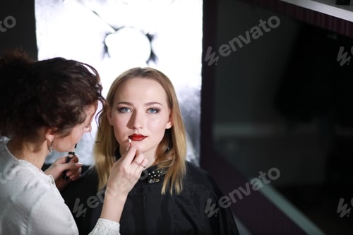 Preview: Young Girl With A Make-Up Artist In The Studio In Front Of A Mirror