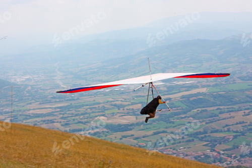Preview: Hang Glider Pilot In Italian Mountains