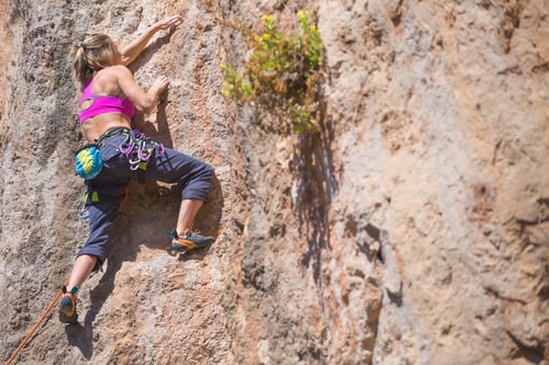 Preview: A Girl Climbs A Rock. The Athlete Trains In Nature. Woman Overcomes Difficult Climbing Route