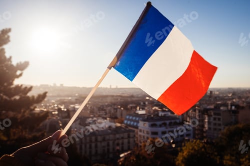 Preview: The Flag Of France On Background Of The View Of Paris From Sacre Coeur Basilica In France In Sunset