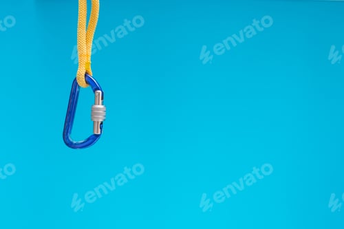 Preview: Blue Carabiner And A Climbing Rope, Equipment For Belaying In Climbing And Mountaineering.
