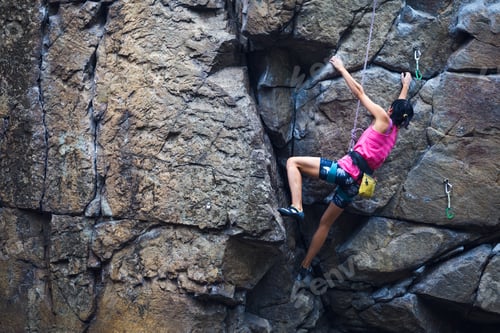 Preview: The Girl Climbs The Granite Rock. Rock Climber Trains On Natural Terrain. Extreme Hobby.
