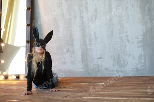 Preview: A Girl In A Black Mask With Long Ears In The Studio