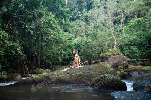 Preview: Yoga Practice And Meditation In Nature. Man Practicing Near River.