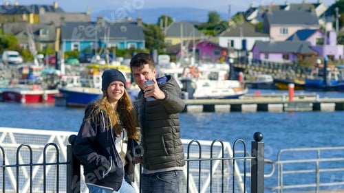 Preview: Young Couple Takes A Selfie At The Harbor Of Dingle