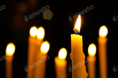 Preview: Close Up View Of The Candles Cutting Through The Darkness.