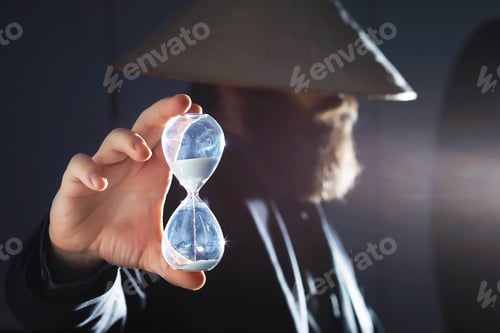 Preview: A Bearded Man In A Suit Holds An Object In His Hand. Concept Of Time And Ideas. Aspiration