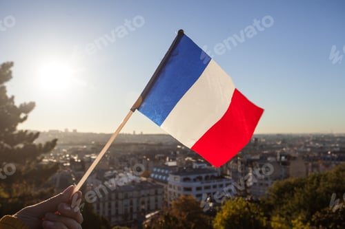Preview: The Flag Of France On Background Of The View Of Paris From Sacre Coeur Basilica In France In Sunset