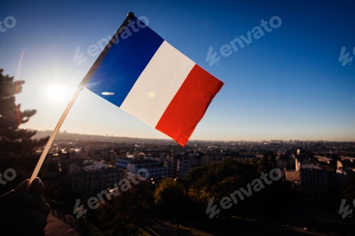 Preview: The Flag Of France On Background Of The View Of Paris From Sacre Coeur Basilica In France In Sunset