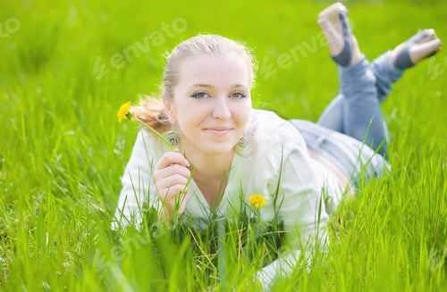 Preview: Girl On Yellow Dandelion On Green Field