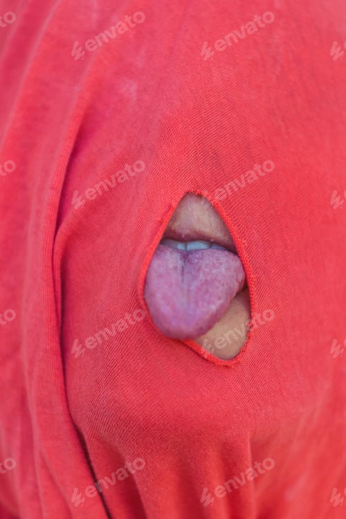 Preview: A Hole In Clothes. Red Cloth. Female Lips And Tongue. Grimace. To Make Faces. Fool.