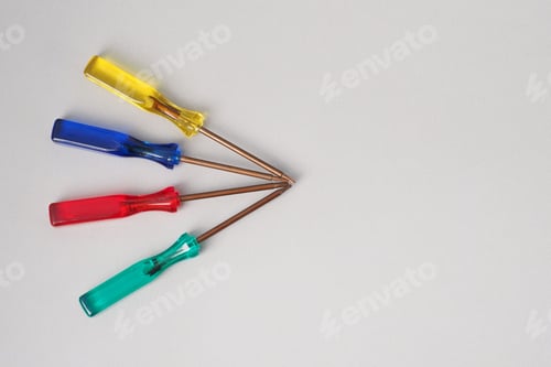 Preview: Many Different Small Special Screwdriver For Repair Laptop On Gray. Copy Space.