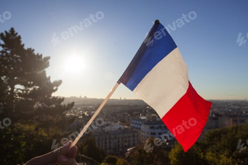 Preview: The Flag Of France On Background Of The View Of Paris From Sacre Coeur Basilica In France In Sunset