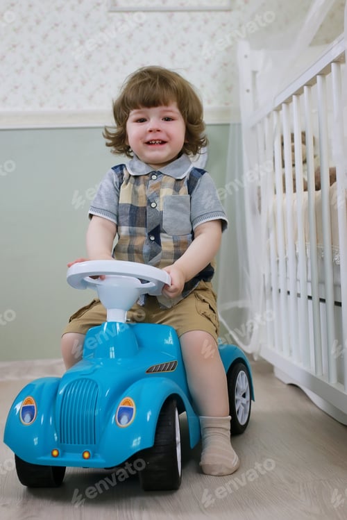 Preview: Litle Boy Sit On A Toy Car