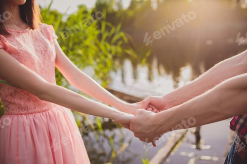 Preview: Young Couple In Love, Attractive Man And Woman Enjoying Romantic Evening On The Beach, Holding