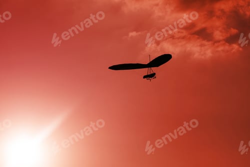 Preview: Hang-Glider Silhouette In Sky In Sunset Time