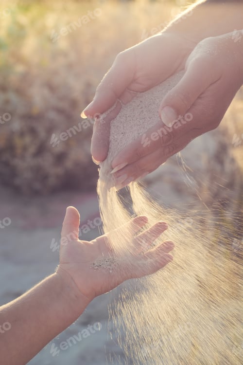Preview: Mother And Small Baby Play With Sand. Mom Throws Sand To The Baby Arms. Active Parents And People