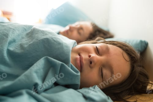 Preview: Sleeping Child Lies In Bed With Mother, Morning Awakening, A Woman Hugs Her Son, The Boy Is