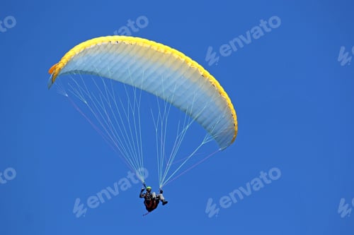 Preview: Paraglider Flying In A Blue Sky