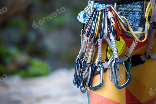 Preview: Safety System And Quickdraw For Climbing. The Girl Is Preparing For The Climb. Rock Climber And