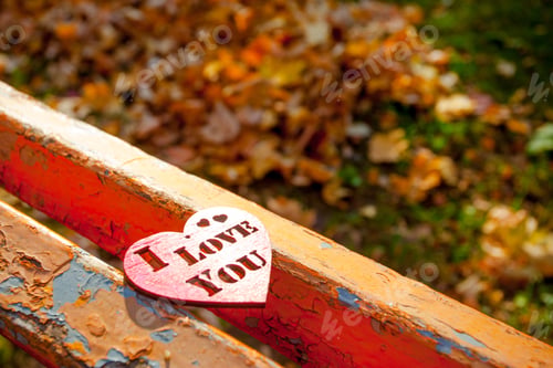 Preview: Red Wooden Heart On The Wooden Bench Background In Autumn
