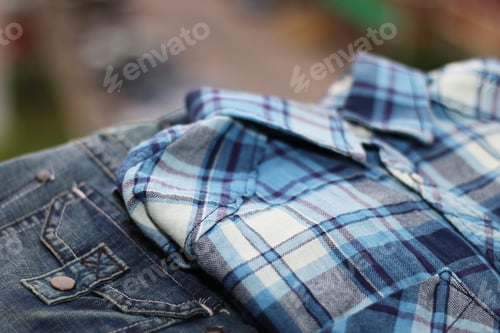 Preview: Close-up of Plaid Shirt and Denim Jeans