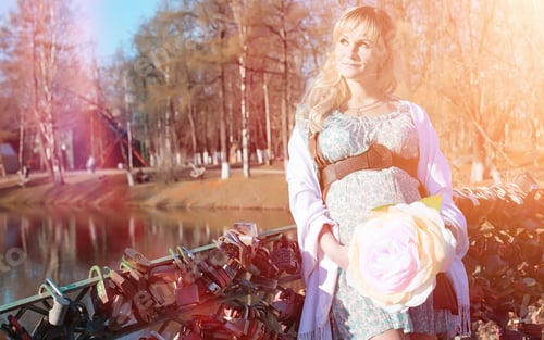 Vista previa: Pregnant Girl On A Walk In The Park. Girl With A Belly In The City Park. Future Mom Is Walking In