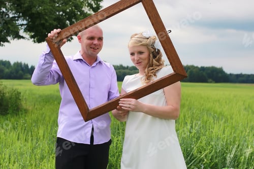 Preview: Couple Lovers Walking In A Green Field In Summer Day