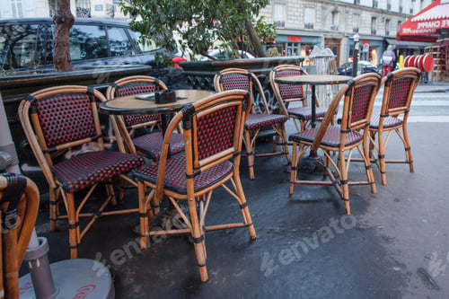Preview: Empty Tables In Between Dining Hours Along A Paris Cobblestone Alley