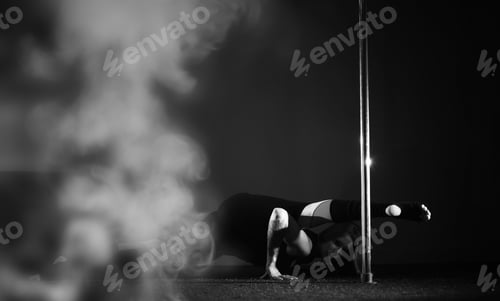 Preview: Girl Doing Exercises On A Sports Equipment. The Dancer On The Pylon In The Studio.