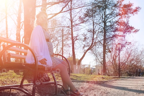 Preview: Pregnant Girl On A Walk In The Park. Girl With A Belly In The City Park. Future Mom Is Walking In