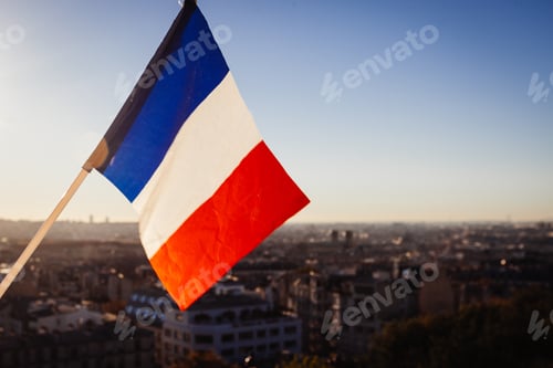 Preview: The Flag Of France On Background Of The View Of Paris From Sacre Coeur Basilica In France In Sunset