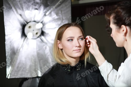 Preview: Young Girl With A Make-Up Artist In The Studio In Front Of A Mirror