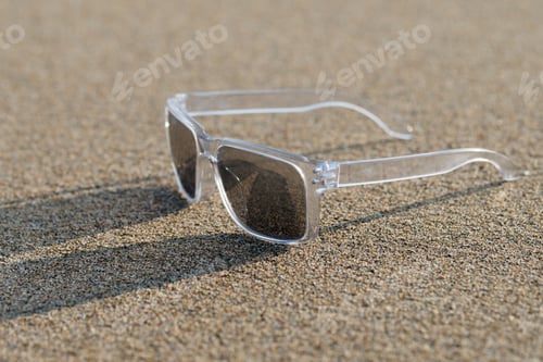 Preview: Sunglasses In The Sand At The Beach In Summer.