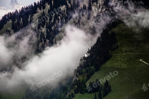 Preview: Swiss Alps With Sunset Shining On Remote Church
