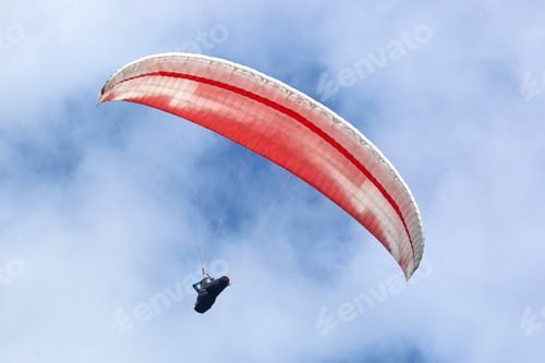 Preview: Red Paraglider In A Blue Sky