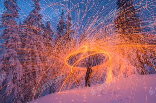 Preview: Man In A Winter Snow Covered Forest Painting By Light With Steel Wool. Breathtaking Picture.
