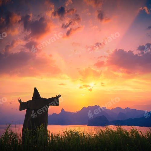 Preview: Silhouette Of Priest With Raised Hands On A Hill Against Sunset Sky Above The Sea With Dramatic